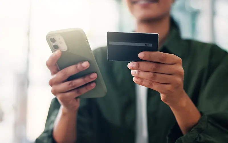 person holding credit card