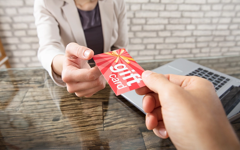 woman holding gift card