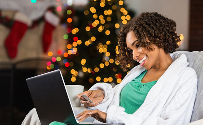 woman opening boxes from online shopping