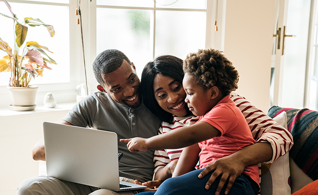 family looking at computer together