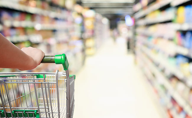 person shopping with cart in a store