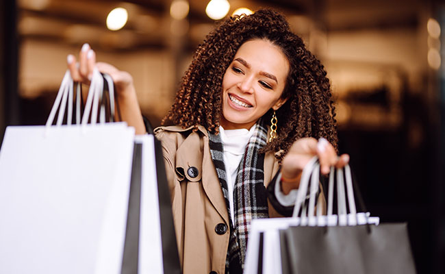 woman carrying bags after shopping