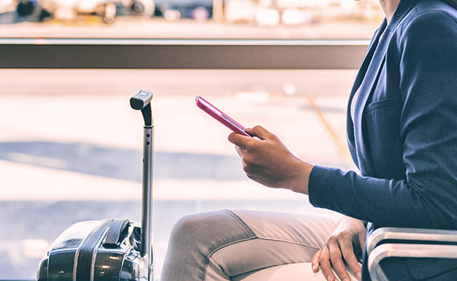 young woman on phone in the airport