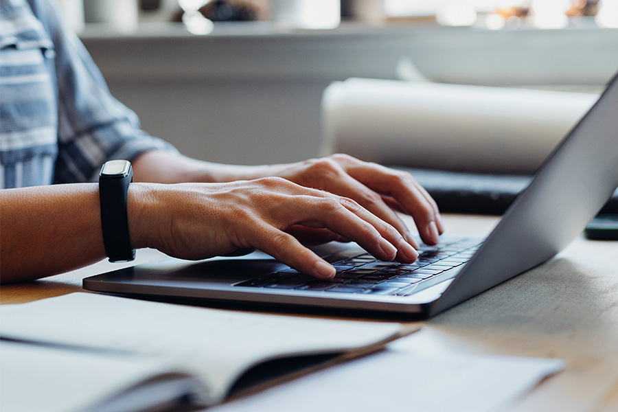 person typing on computer