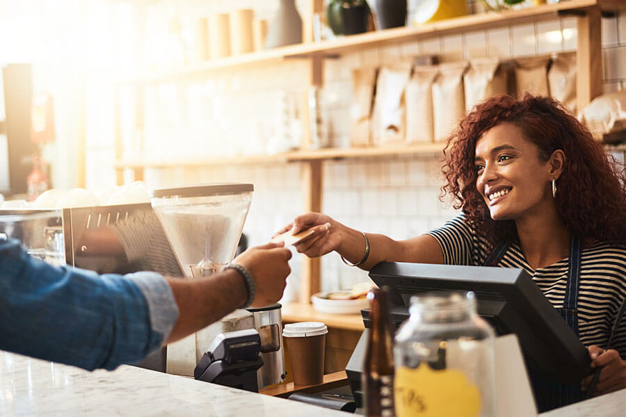 barista handing customer back card