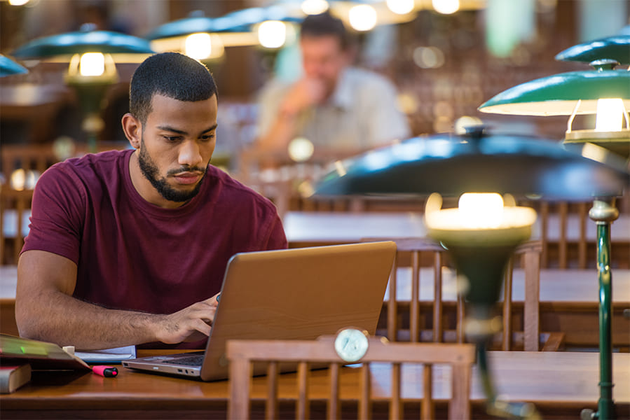 student studying with laptop