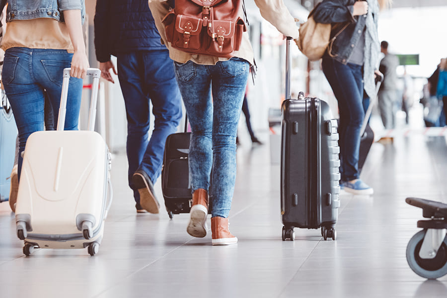 rear view of a group traveling in airport